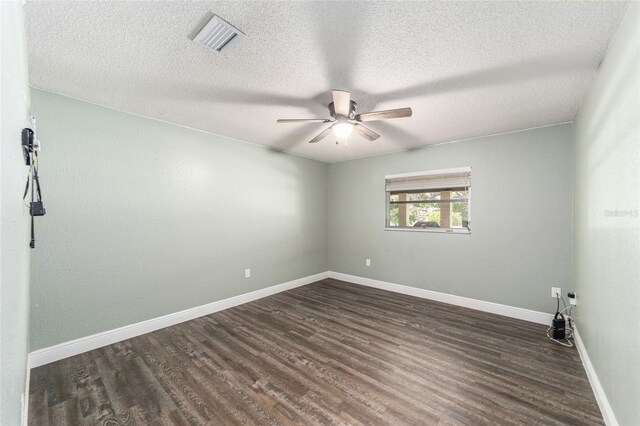 unfurnished room featuring hardwood / wood-style floors, ceiling fan, and a textured ceiling