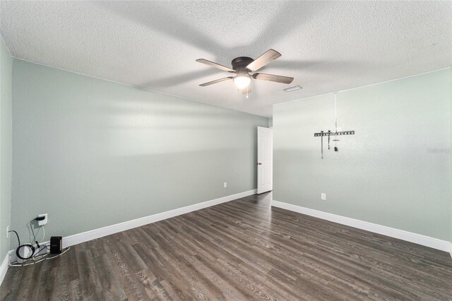 empty room featuring ceiling fan, a textured ceiling, and wood-type flooring