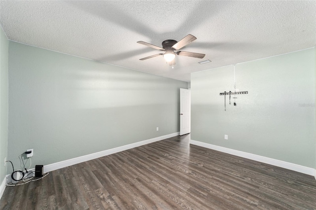 empty room featuring a ceiling fan, a textured ceiling, baseboards, and wood finished floors