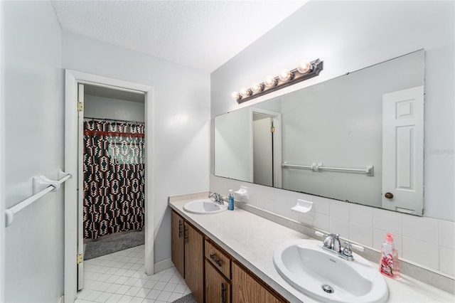 bathroom featuring backsplash, tile patterned flooring, a shower with shower curtain, and vanity