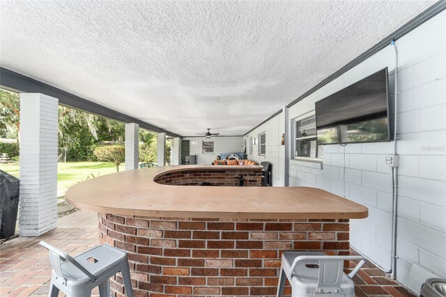 view of patio / terrace featuring ceiling fan