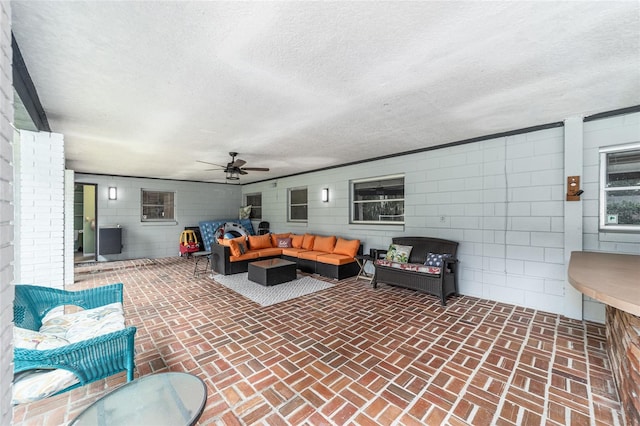 exterior space featuring ceiling fan and outdoor lounge area