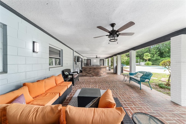 view of patio / terrace featuring an outdoor living space and ceiling fan