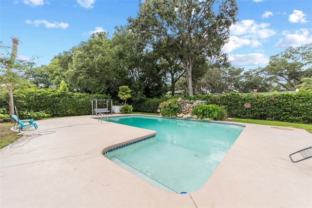 view of pool with a patio area and a fenced in pool