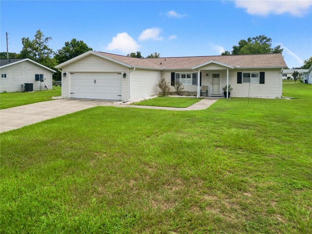 single story home with a front yard and a garage