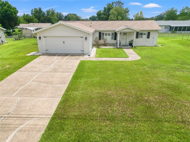 ranch-style house with a front lawn and a garage