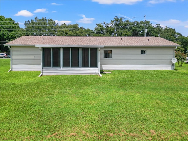 back of house with a yard