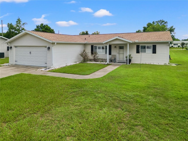 single story home featuring a garage, covered porch, and a front lawn