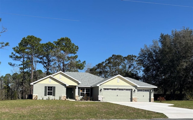 craftsman-style house with a garage and a front lawn