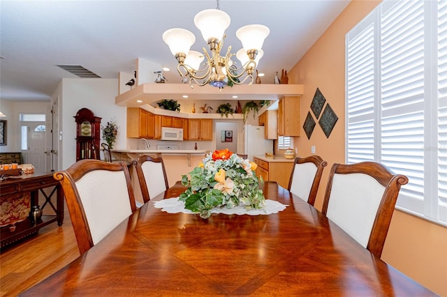 dining room with a notable chandelier