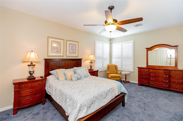 bedroom with ceiling fan and light carpet