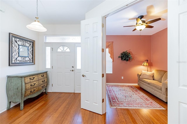 foyer featuring hardwood / wood-style flooring and ceiling fan