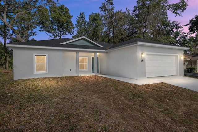 5 Emerald Trl, Ocala, FL 34472 - ranch-style house featuring driveway, roof with shingles, a garage, a yard, and stucco siding