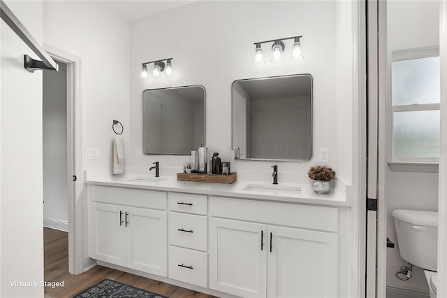 5 Emerald Trl, Ocala, FL 34472 - full bath featuring a sink, double vanity, toilet, and wood finished floors