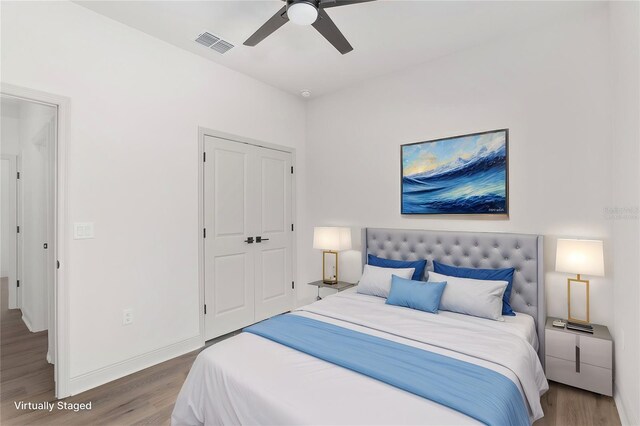 5 Emerald Trl, Ocala, FL 34472 - bedroom with baseboards, visible vents, wood finished floors, and a closet