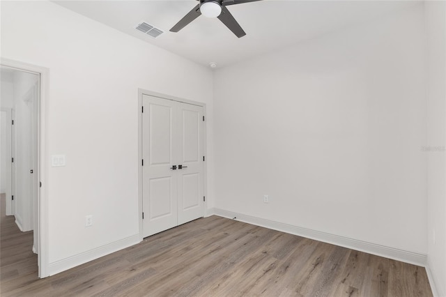 5 Emerald Trl, Ocala, FL 34472 - unfurnished bedroom featuring baseboards, a ceiling fan, light wood finished floors, and visible vents
