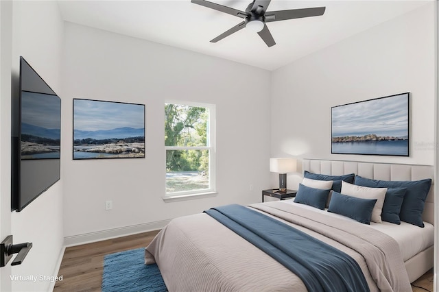 5 Emerald Trl, Ocala, FL 34472 - bedroom with baseboards, a ceiling fan, and wood finished floors