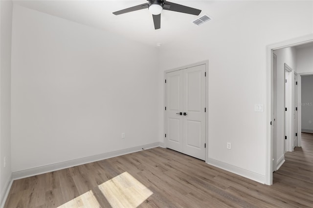 5 Emerald Trl, Ocala, FL 34472 - unfurnished bedroom with visible vents, baseboards, ceiling fan, and light wood-type flooring