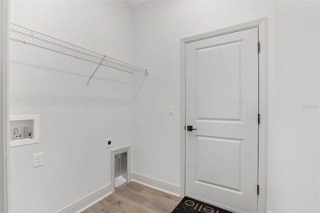 5 Emerald Trl, Ocala, FL 34472 - washroom featuring laundry area, baseboards, washer hookup, light wood finished floors, and hookup for an electric dryer
