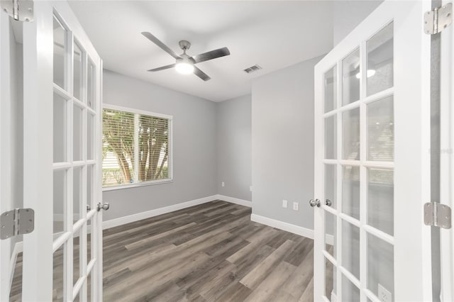 spare room featuring french doors, ceiling fan, and hardwood / wood-style floors