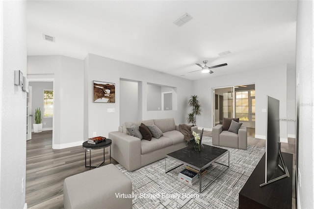 living room with hardwood / wood-style flooring and ceiling fan