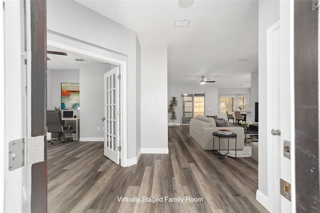 entrance foyer featuring dark wood-type flooring, ceiling fan, and french doors