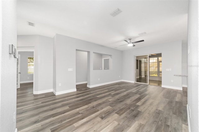 unfurnished room with dark hardwood / wood-style floors and ceiling fan