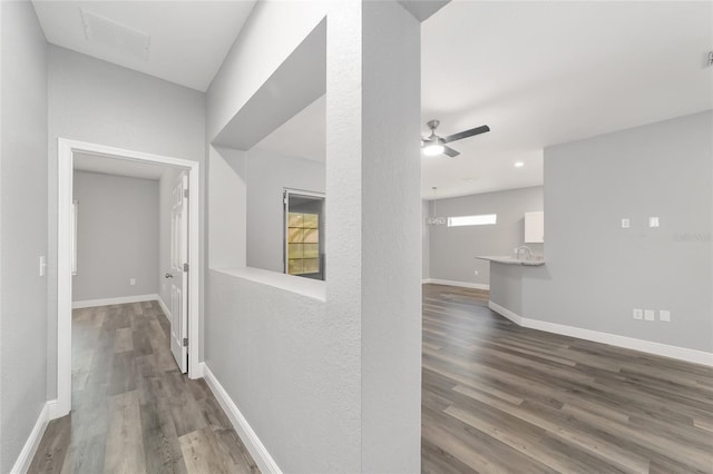 corridor featuring hardwood / wood-style flooring