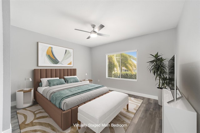 bedroom featuring ceiling fan and dark hardwood / wood-style flooring