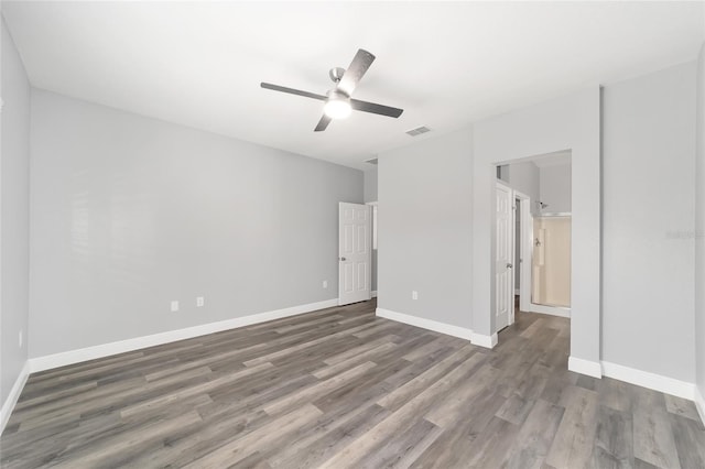 spare room featuring dark hardwood / wood-style floors and ceiling fan