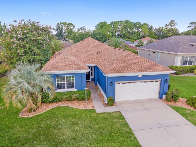 view of front of home featuring a garage and a front yard