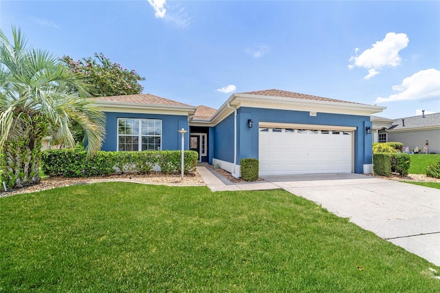 view of front of home featuring a garage and a front lawn