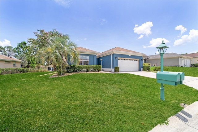 view of front of property with a garage and a front lawn