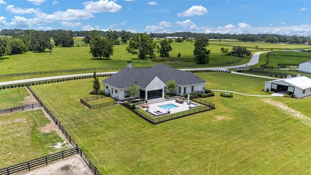 birds eye view of property featuring a rural view