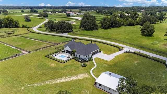 birds eye view of property featuring a rural view