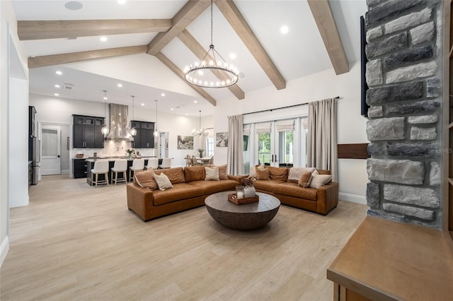 living room with beam ceiling, french doors, an inviting chandelier, high vaulted ceiling, and light wood-type flooring