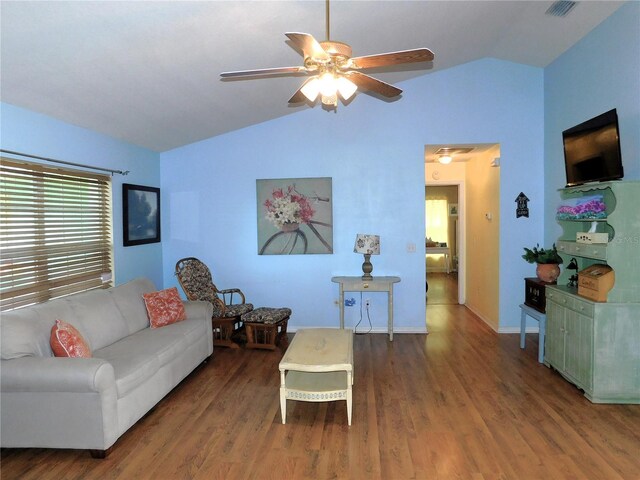 living room with wood-type flooring, ceiling fan, and vaulted ceiling