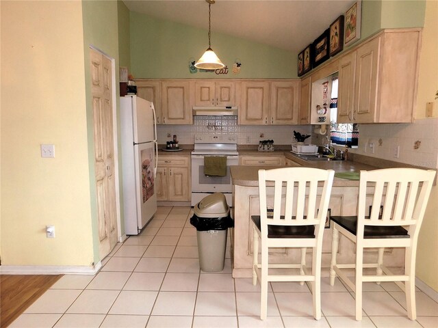 kitchen with lofted ceiling, light hardwood / wood-style floors, tasteful backsplash, and white appliances