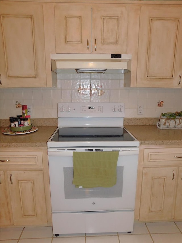 kitchen featuring white electric range, decorative backsplash, wall chimney range hood, and light brown cabinets