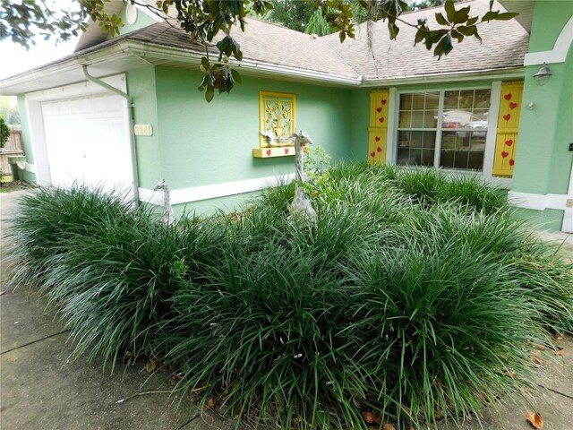 view of property exterior with a garage