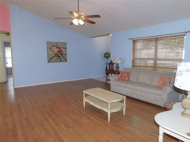 living room featuring hardwood / wood-style flooring, vaulted ceiling, a wealth of natural light, and ceiling fan