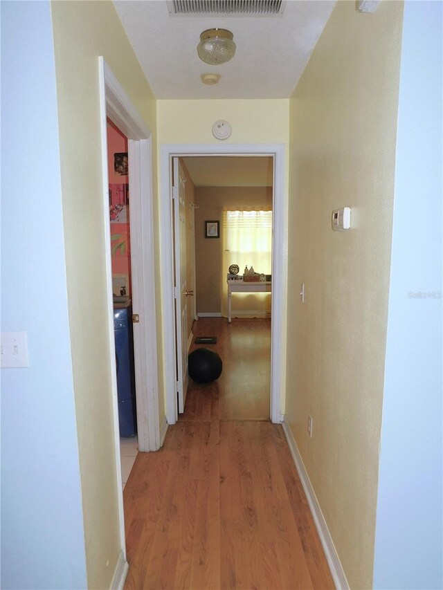 corridor featuring hardwood / wood-style flooring