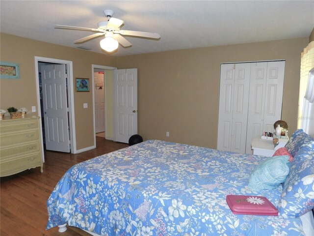 bedroom with ceiling fan and dark hardwood / wood-style floors