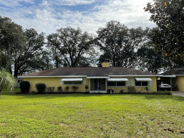 ranch-style house with a front yard