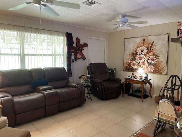 living room featuring ceiling fan and light tile patterned floors