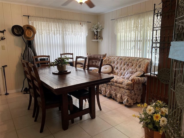 tiled dining room featuring ceiling fan