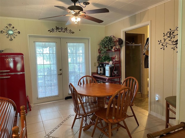 dining room featuring french doors, light tile patterned floors, and ceiling fan