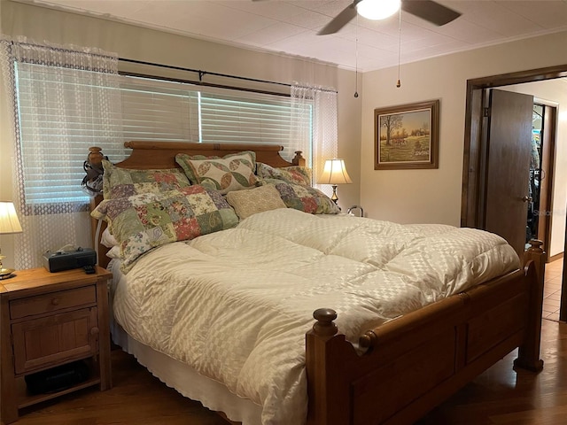 bedroom featuring hardwood / wood-style flooring and ceiling fan