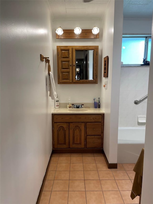 bathroom with ornamental molding, vanity, shower / tub combination, and tile patterned flooring