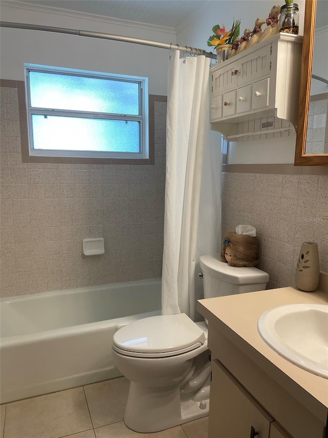 full bathroom featuring tile patterned flooring, toilet, vanity, tile walls, and shower / tub combo